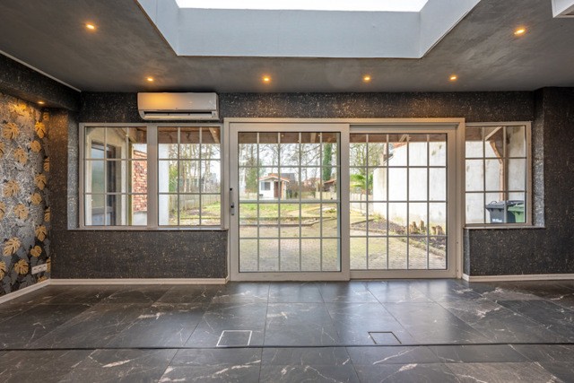 Centraal gelegen woning met 3 slaapkamers, garage en ZW-tuin