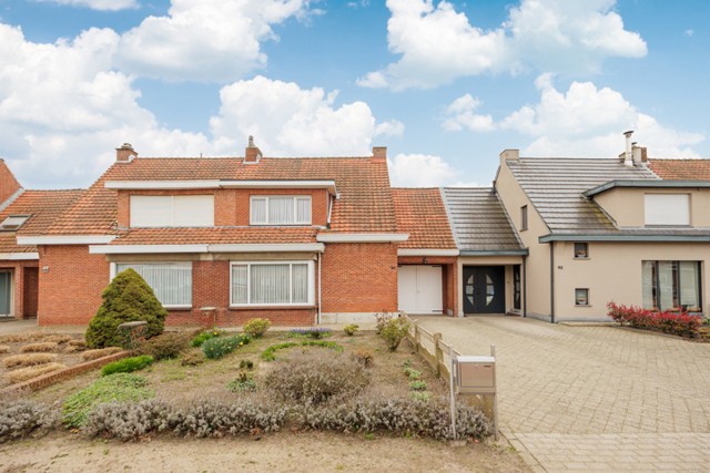 Woning met 3 slpk, garage en grote  tuin 